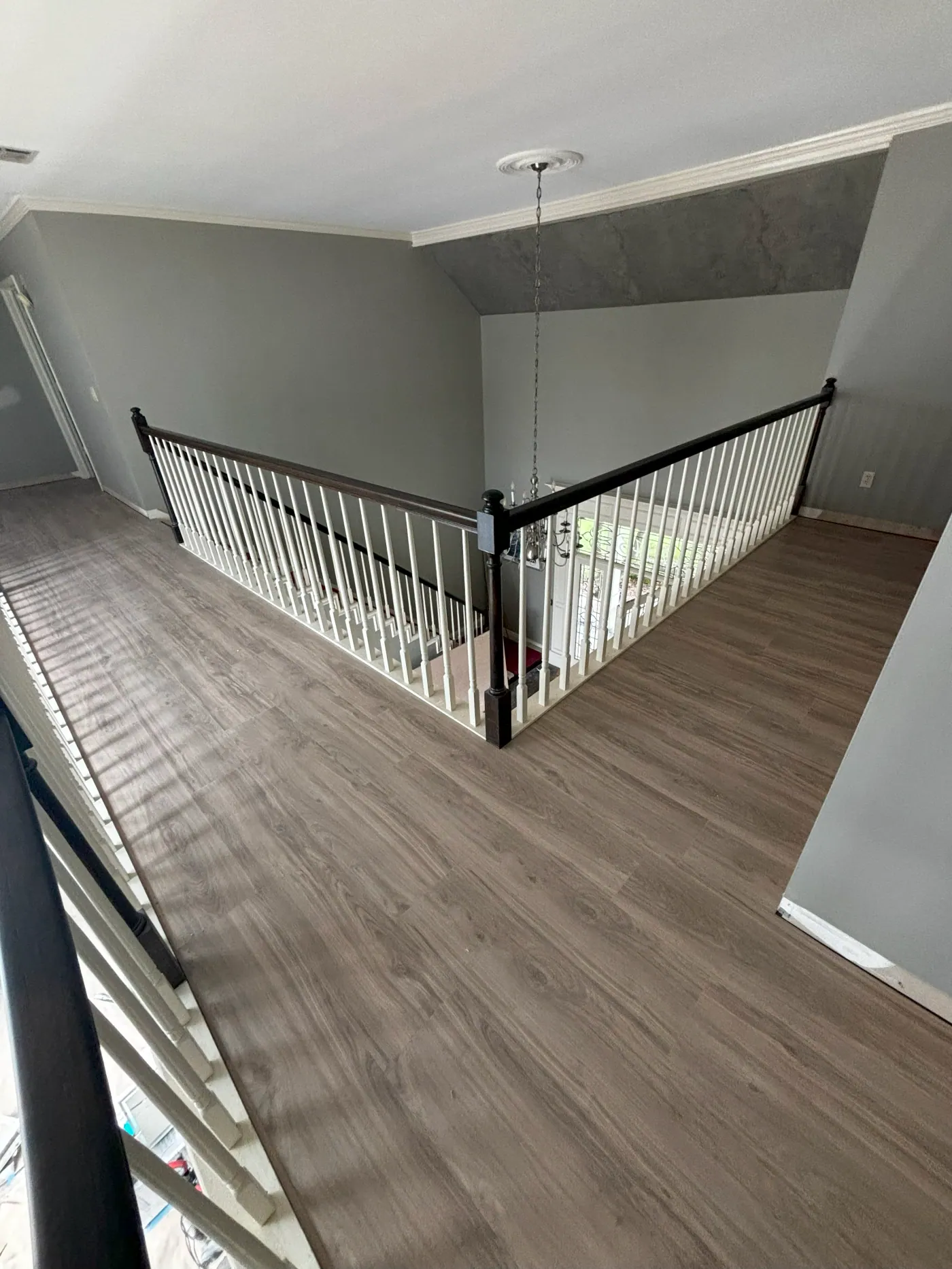 Luxury vinyl plank flooring on a staircase landing in a Tulsa home