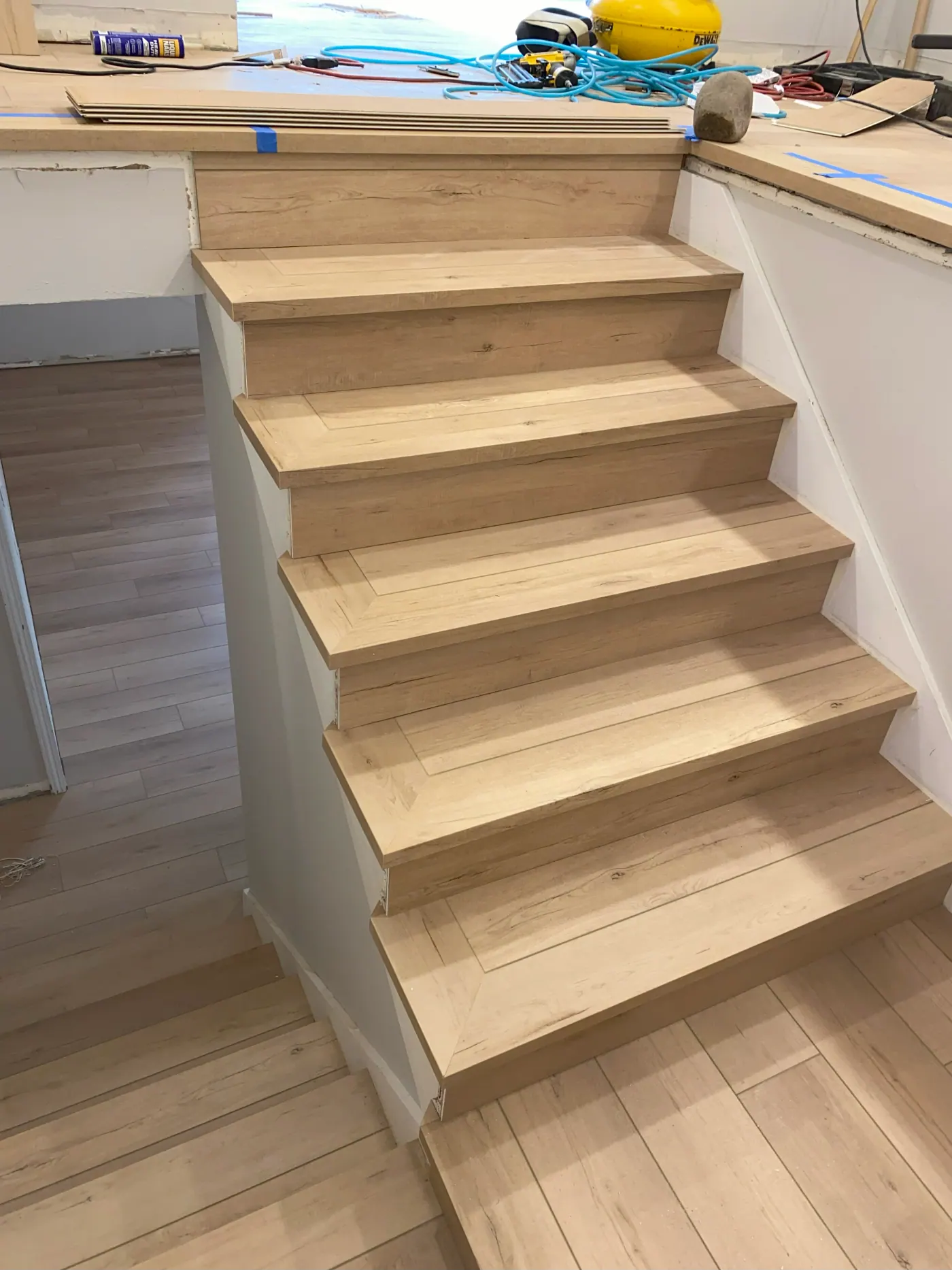 White oak stair treads against white risers in a Tulsa, OK home